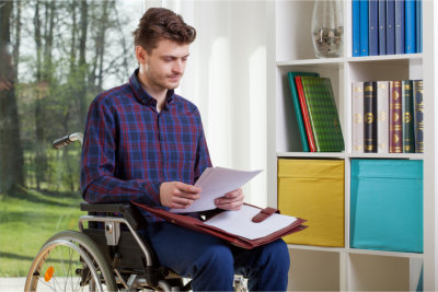 Person in wheelchair reading