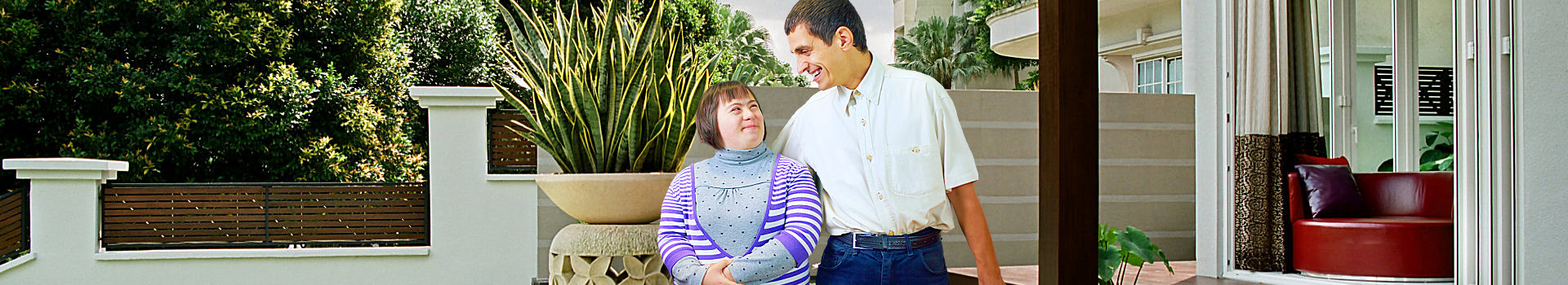 a man and a young girl smiling at each other