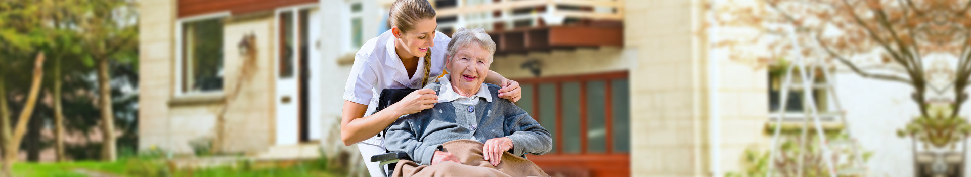 happy elderly woman with her caregiver